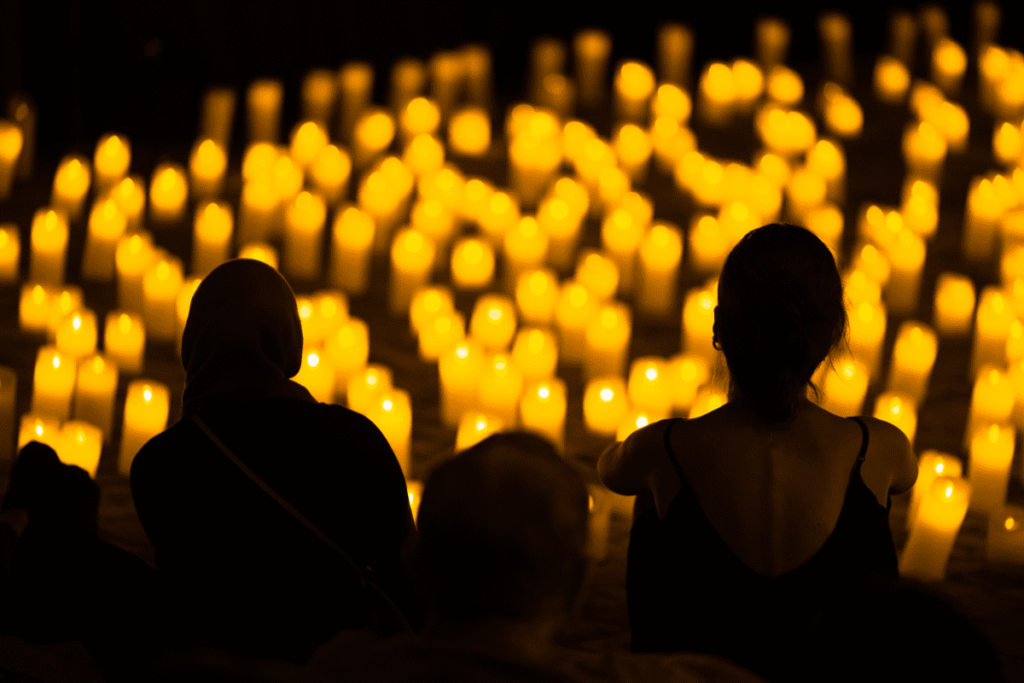 Audience watching a candlelight concert