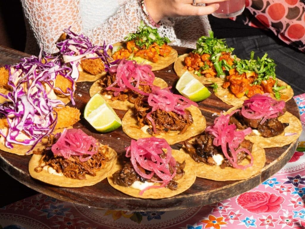 A platter of tacos filled with meat at Mæxico.