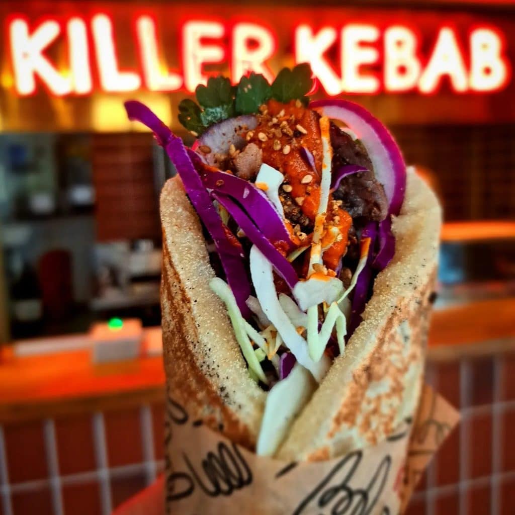 Kebab in front of neon sign at Killer Kebab in Copenhagen