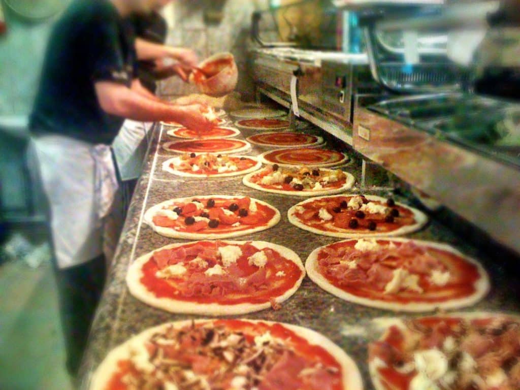 Chef preparing pizzas at Pizzeria La Fiorita in Copenhagen